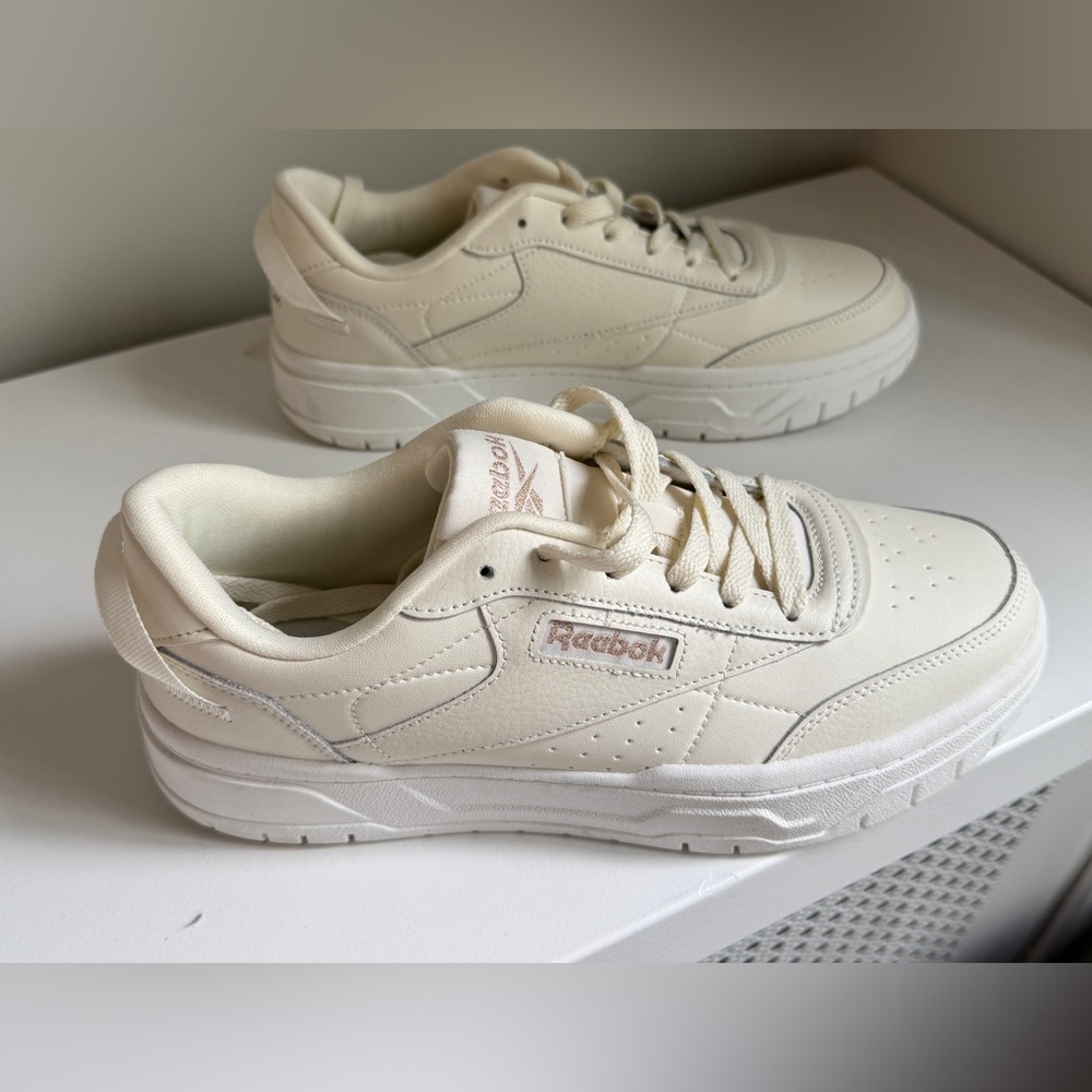 Reebok Off-White Sneakers with Rose Gold accents and White soles. Women’s size 9